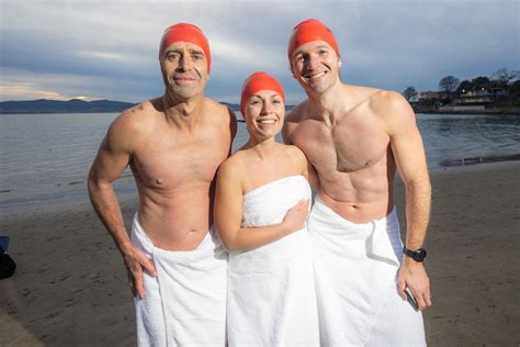 swim in the nude|Thousands brave morning freeze to bare all at Dark Mofo nude swim.